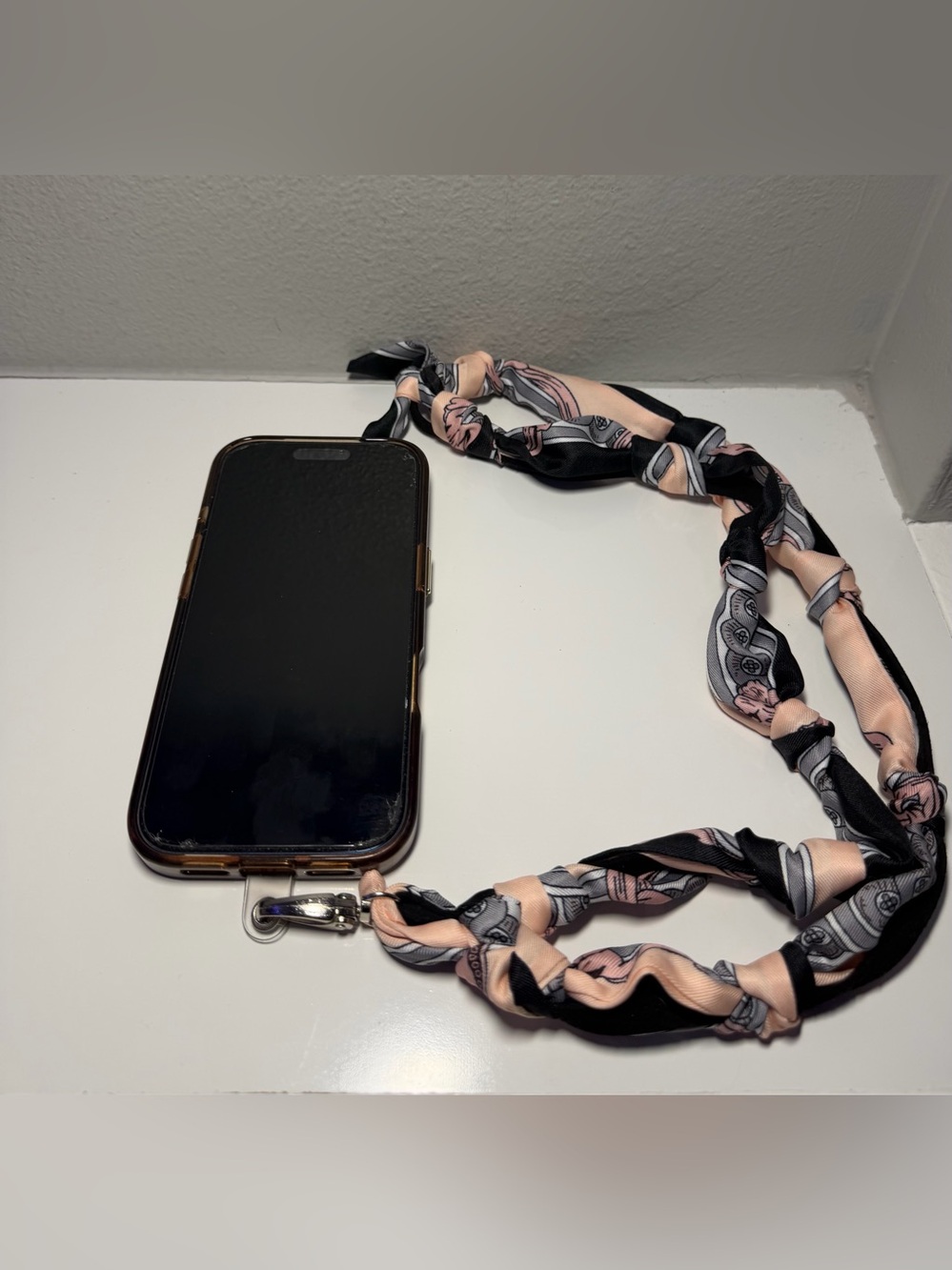 Silk-Twilly Pink and Black tied onto a leather lanyard holder/cell phone cord. - Picture 3 of 12